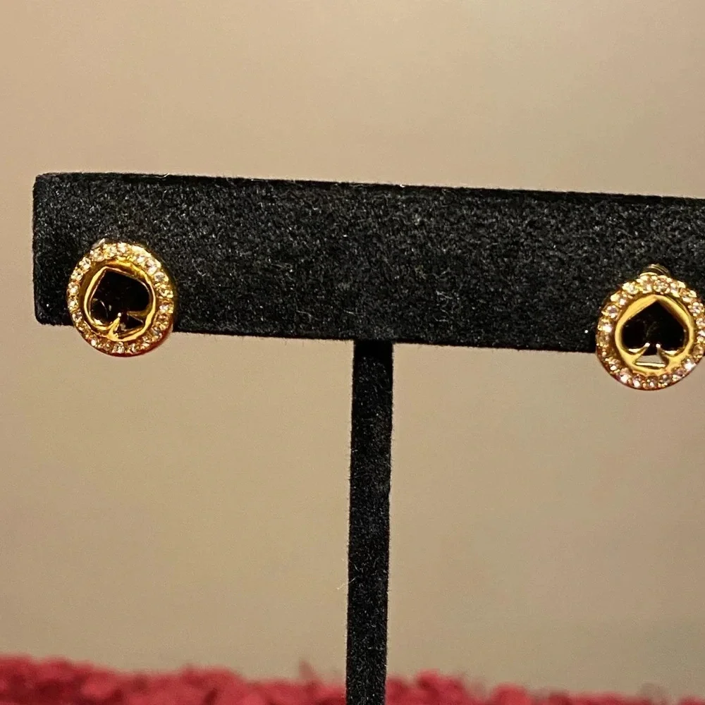 Kate Spade “spot the spade” gold tone earrings with spade cut out in the center